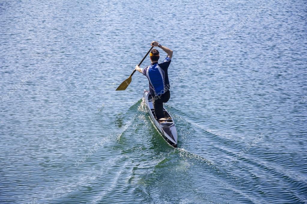 depositphotos_53994665-stock-photo-man-rowing-in-a-canoe